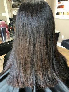 smoothing treatment at the salon after brunette
